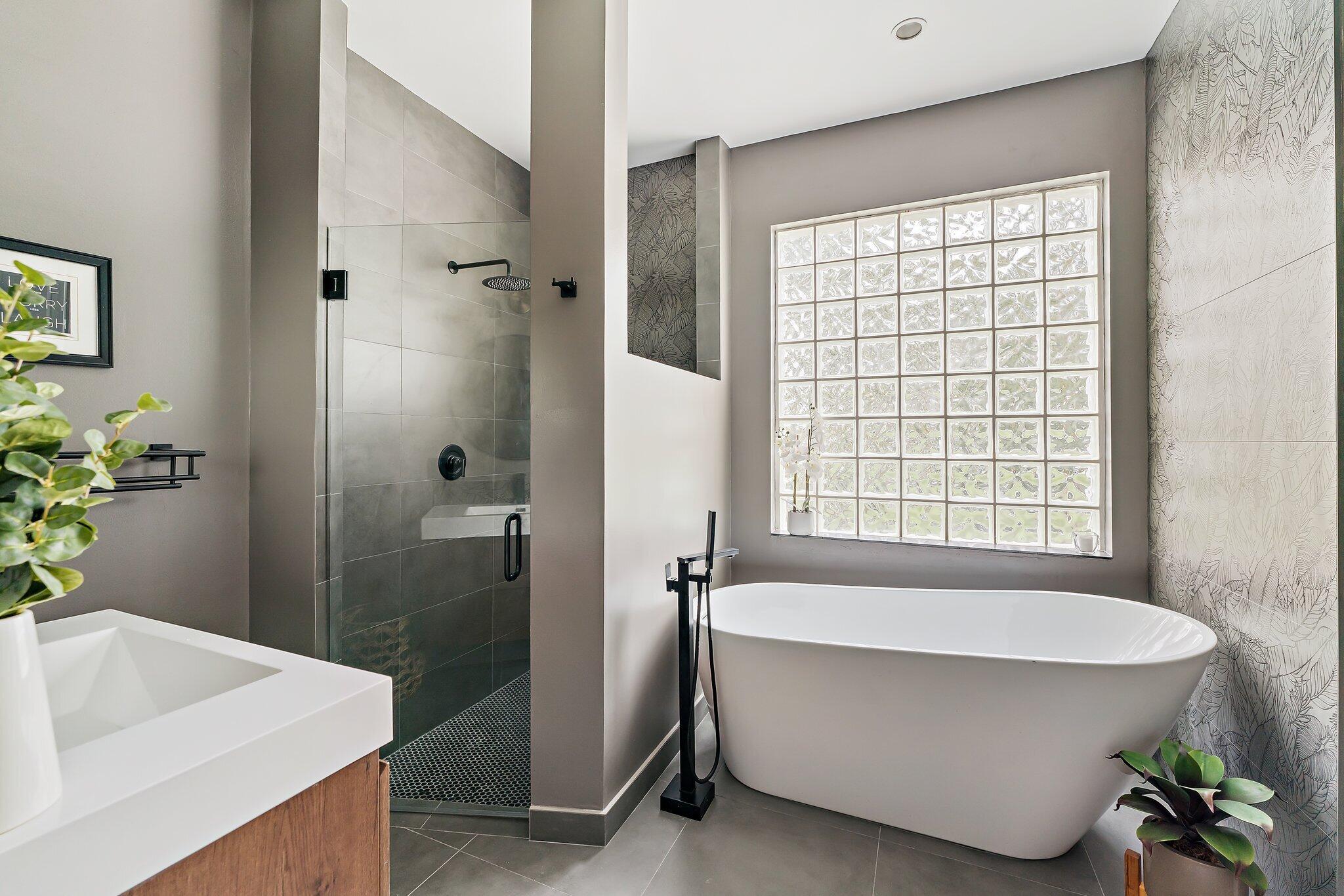 18263 River Oaks Drive Jupiter, FL 33458 - Photo 41 of 49 a bathroom with a bathtub and shower