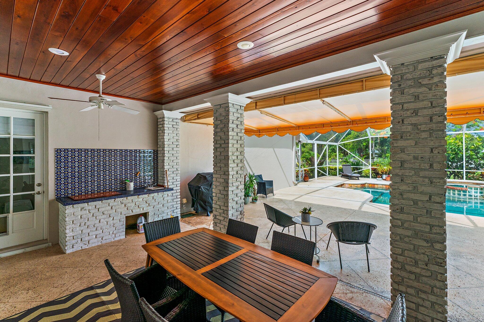 18263 River Oaks Drive Jupiter, FL 33458 - Photo 42 of 49 a view of an outdoor space with seating area