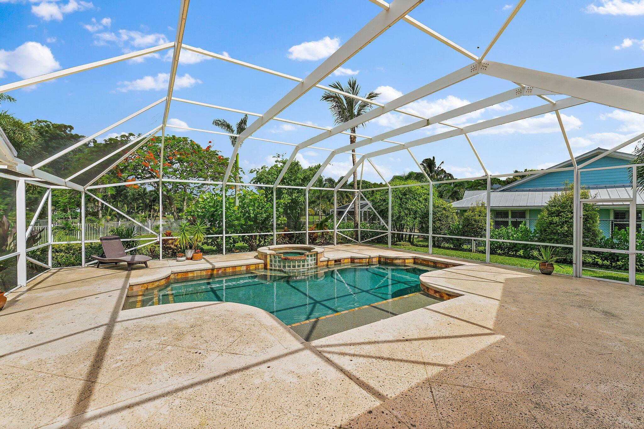 18263 River Oaks Drive Jupiter, FL 33458 - Photo 44 of 49 a view of a swimming pool with a patio