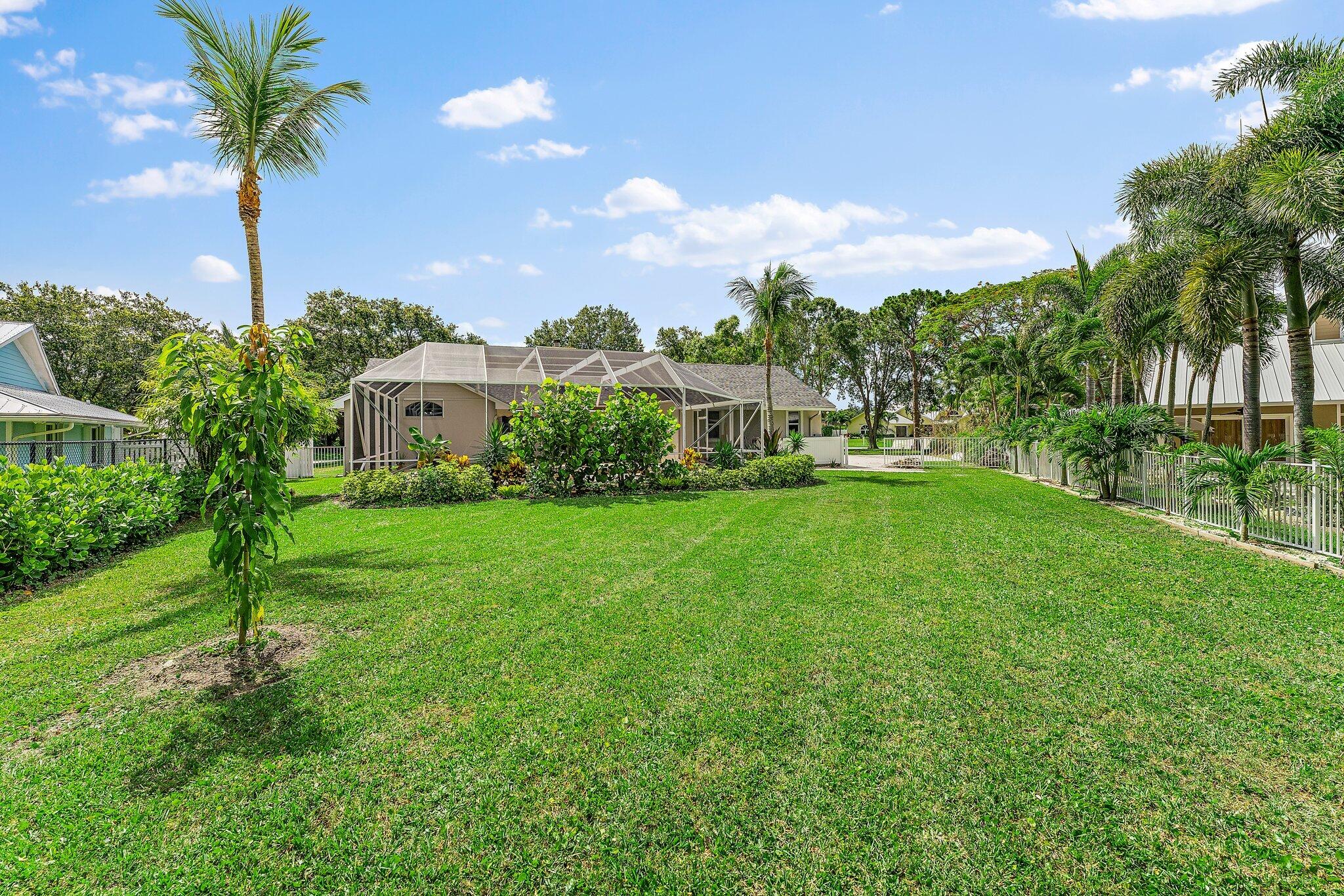 18263 River Oaks Drive Jupiter, FL 33458 - Photo 47 of 49 a house view with a garden space