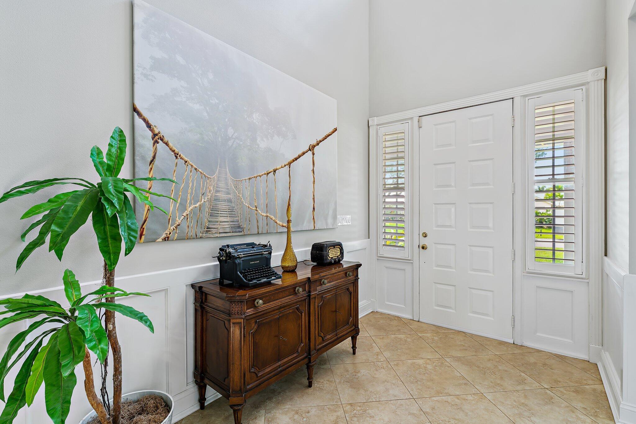18263 River Oaks Drive Jupiter, FL 33458 - Photo 7 of 49 a living room with furniture and a potted plant