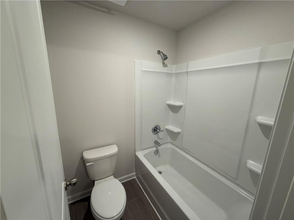 5143 Longview Run Decatur, GA 30035 - Photo 15 of 17 a bathroom with a toilet and a tub