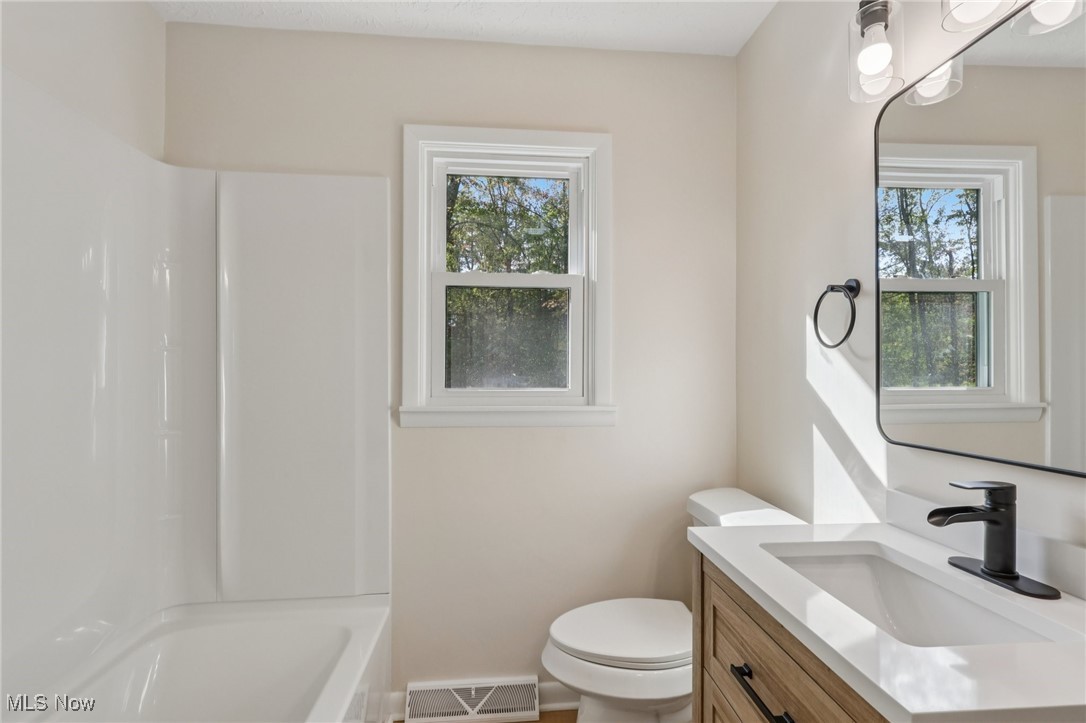 50963 Becker Road Oberlin, OH 44074 - Photo 15 of 37 Full bathroom with vanity and bathtub / shower combination
