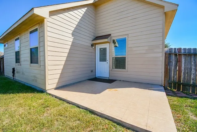 a view of front door and yard