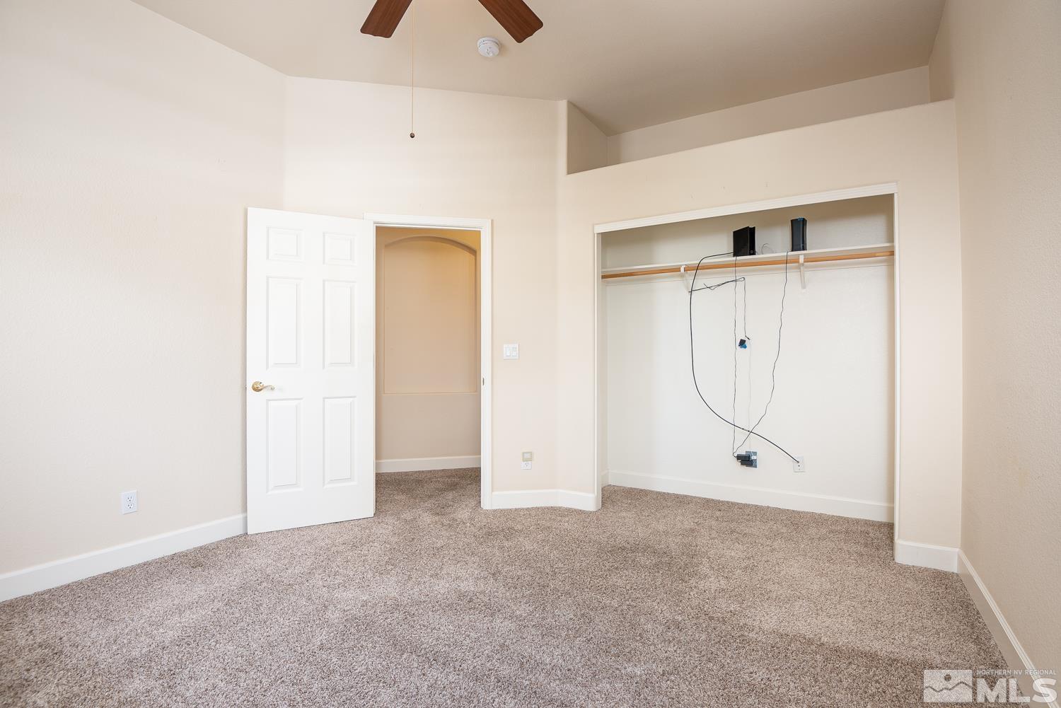 2647 Skyline Drive Minden, NV 89423 - Photo 17 of 39 an empty room with cabinet and mirrors