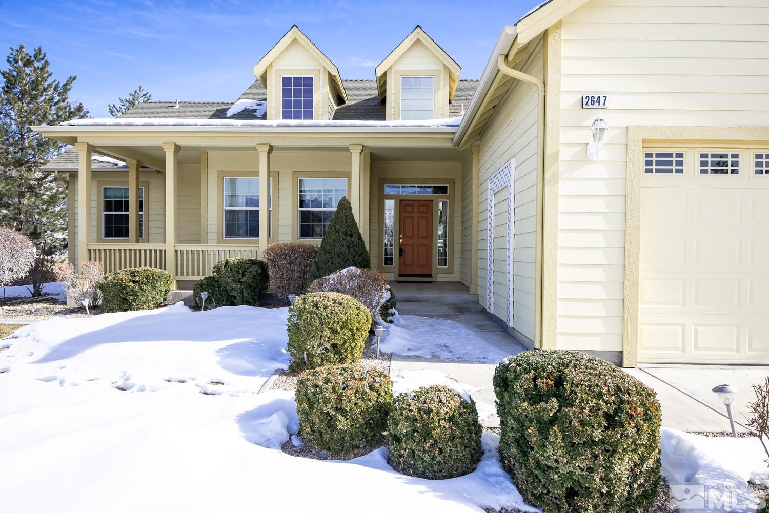 2647 Skyline Drive Minden, NV 89423 - Photo 2 of 39 a front view of a house with a yard