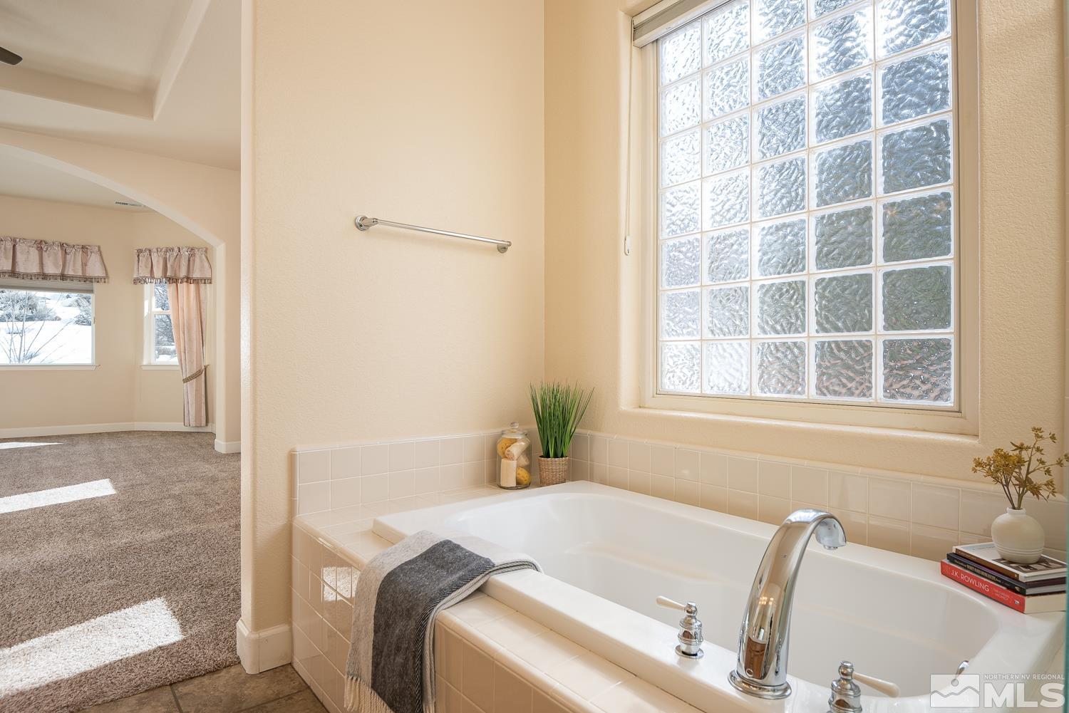 2647 Skyline Drive Minden, NV 89423 - Photo 25 of 39 a bath tub sitting in a bathroom next to a window