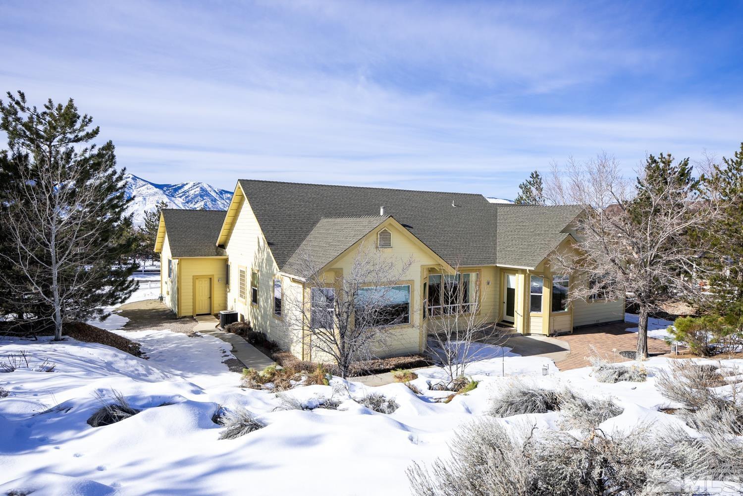 2647 Skyline Drive Minden, NV 89423 - Photo 34 of 39 a front view of a house with a yard covered in snow