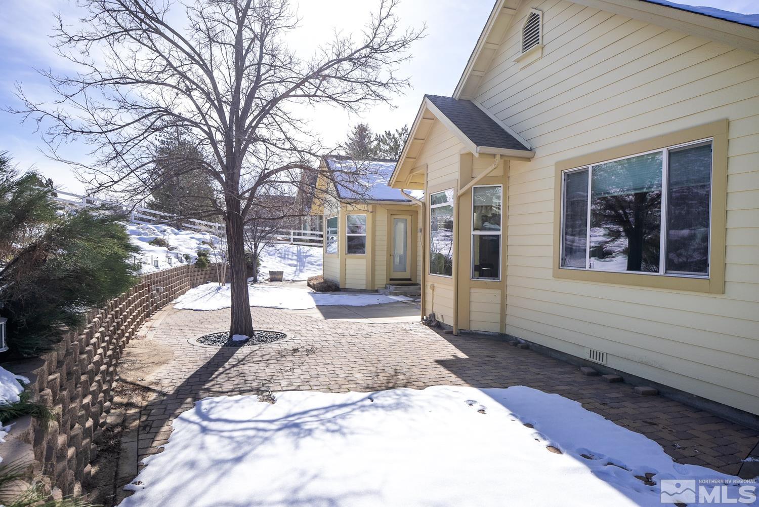 2647 Skyline Drive Minden, NV 89423 - Photo 36 of 39 a view of a house with a yard covered in snow