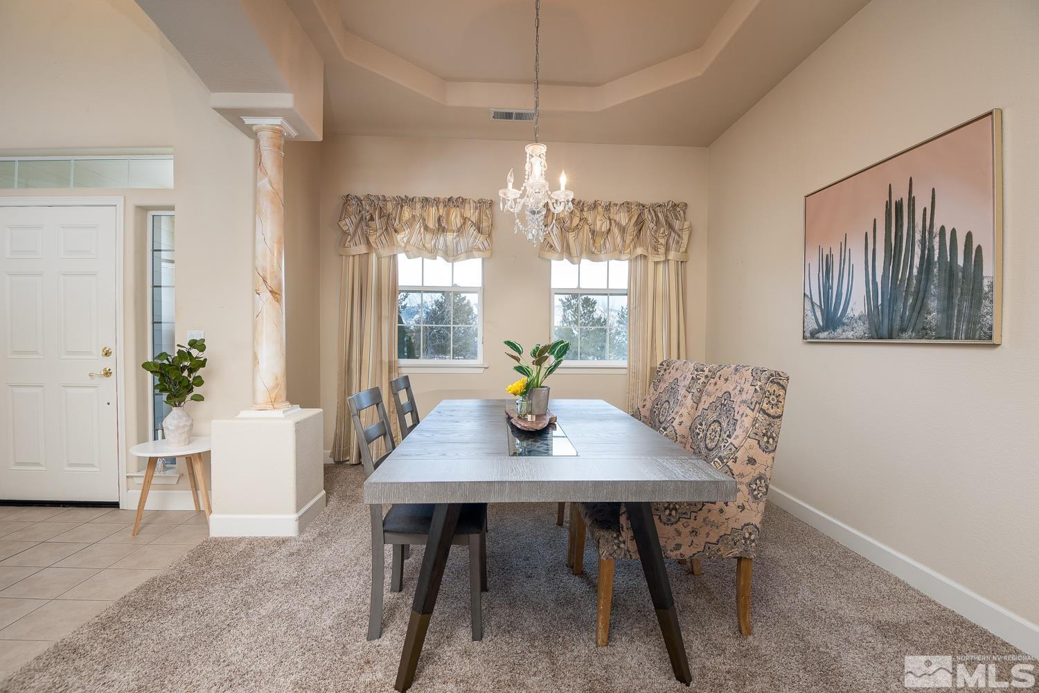 2647 Skyline Drive Minden, NV 89423 - Photo 9 of 39 a dining room with furniture potted plants and wooden floor