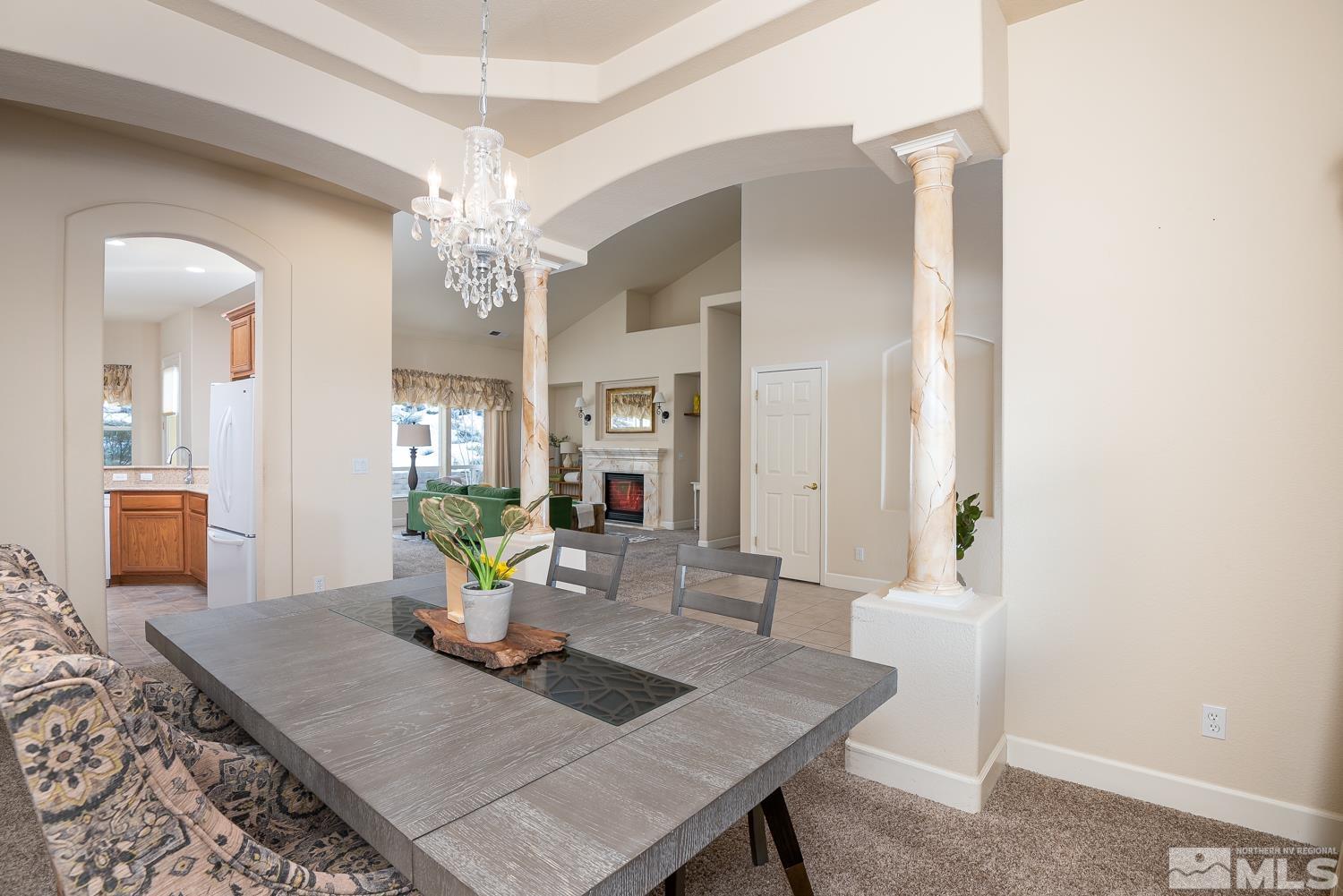 2647 Skyline Drive Minden, NV 89423 - Photo 10 of 39 a view of a dining room with furniture and a chandelier
