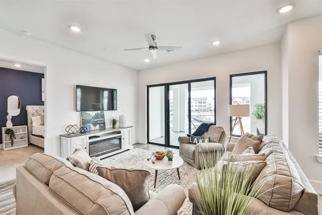 a living room with furniture or kitchen view and a wooden floor