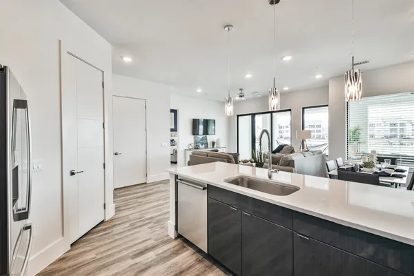 a kitchen with stainless steel appliances granite countertop a sink and stove