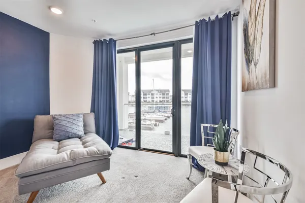 a spacious bedroom with a bed and a flat screen tv