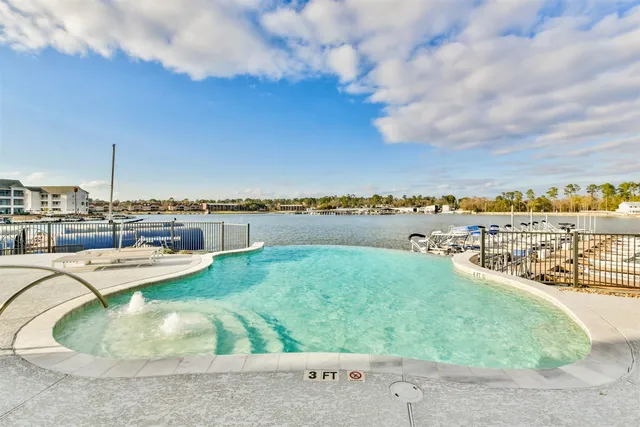 a view of a garden with lawn chairs