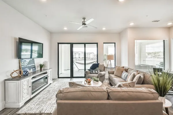 a living room with furniture and a large window