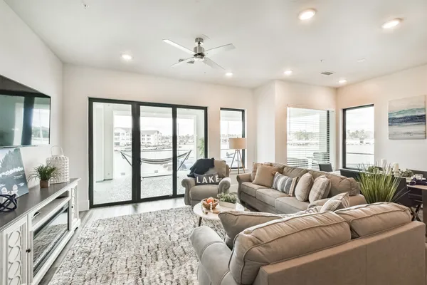 a living room with furniture and a large window