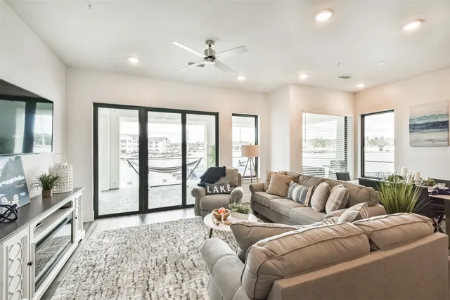 a living room with furniture and a large window
