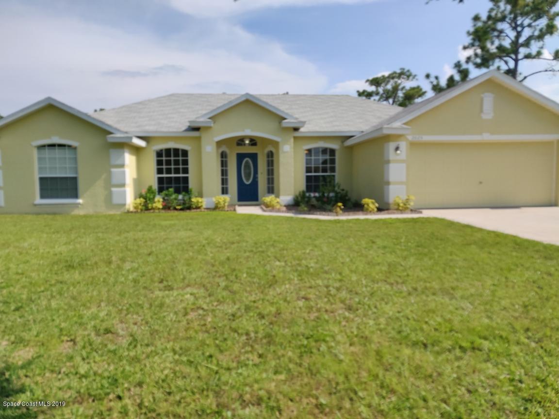2025 Benjamin Road Grant Valkaria, FL 32950 - Photo 1 of 40 a view of a house with a yard and front view of a house