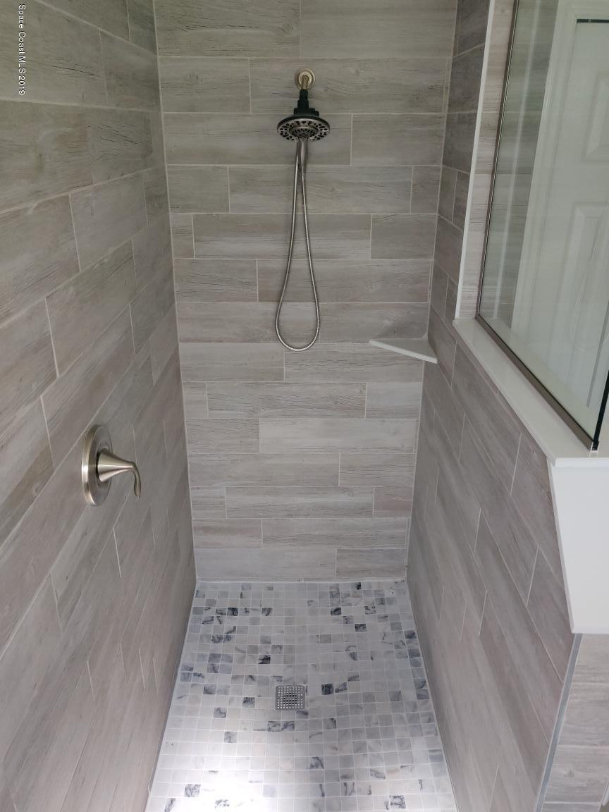 2025 Benjamin Road Grant Valkaria, FL 32950 - Photo 32 of 40 a bathroom with a shower