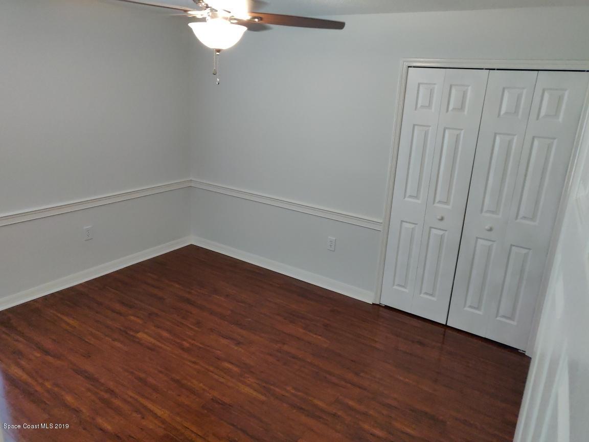 2025 Benjamin Road Grant Valkaria, FL 32950 - Photo 36 of 40 a view of an empty room with wooden floor