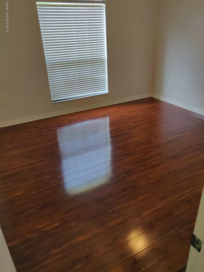 2025 Benjamin Road Grant Valkaria, FL 32950 - Photo 38 of 40 a view of a room with wooden floor and a window