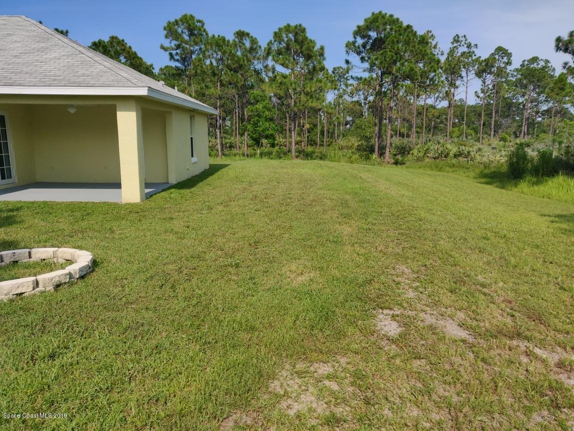 2025 Benjamin Road Grant Valkaria, FL 32950 - Photo 9 of 40 a view of a backyard