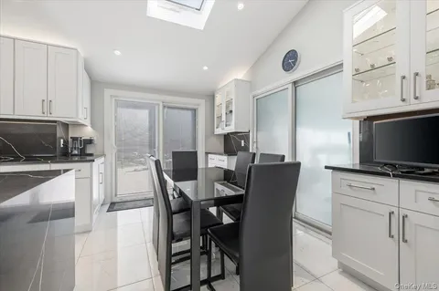 a utility room with sink dryer and washer
