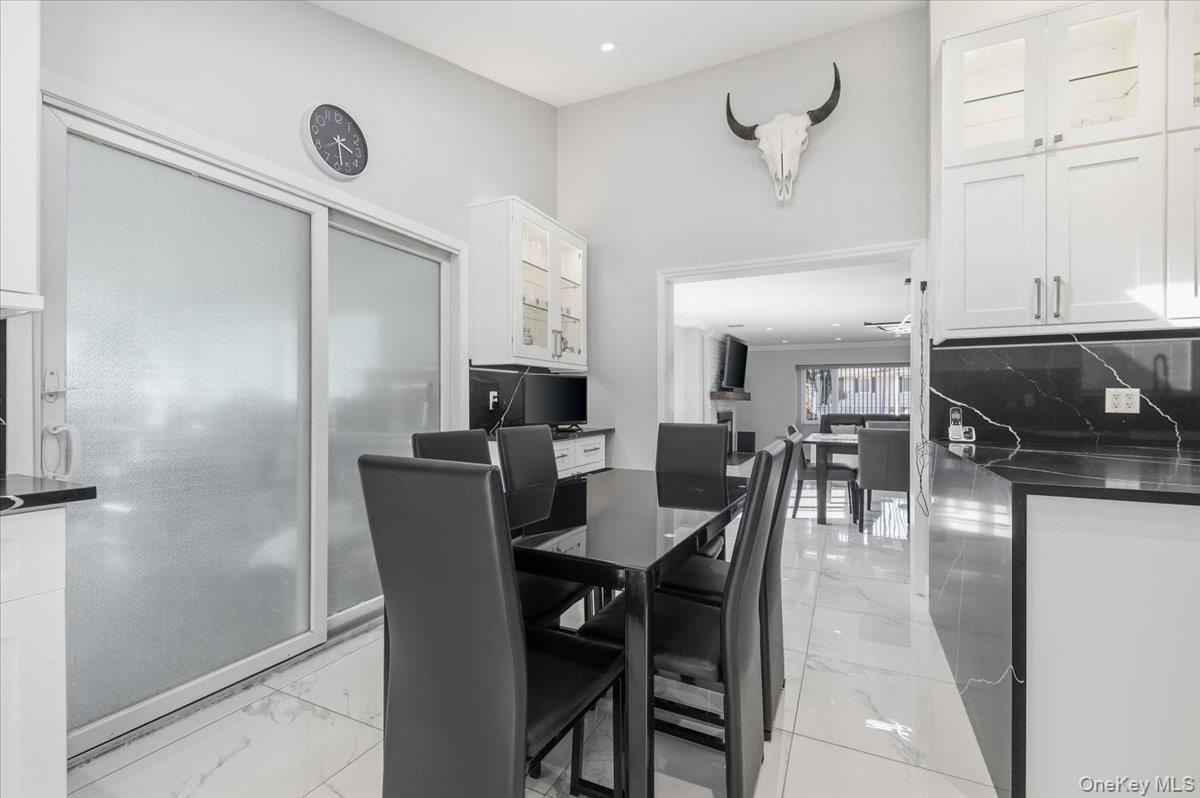 98 Barry Lane Syosset, NY 11791 - Photo 18 of 43 a view of a dining room with furniture