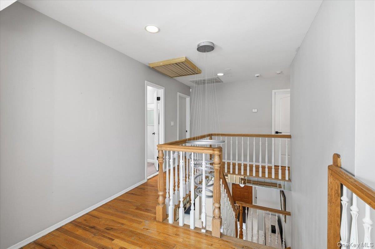 98 Barry Lane Syosset, NY 11791 - Photo 27 of 43 a view of entryway with wooden floor