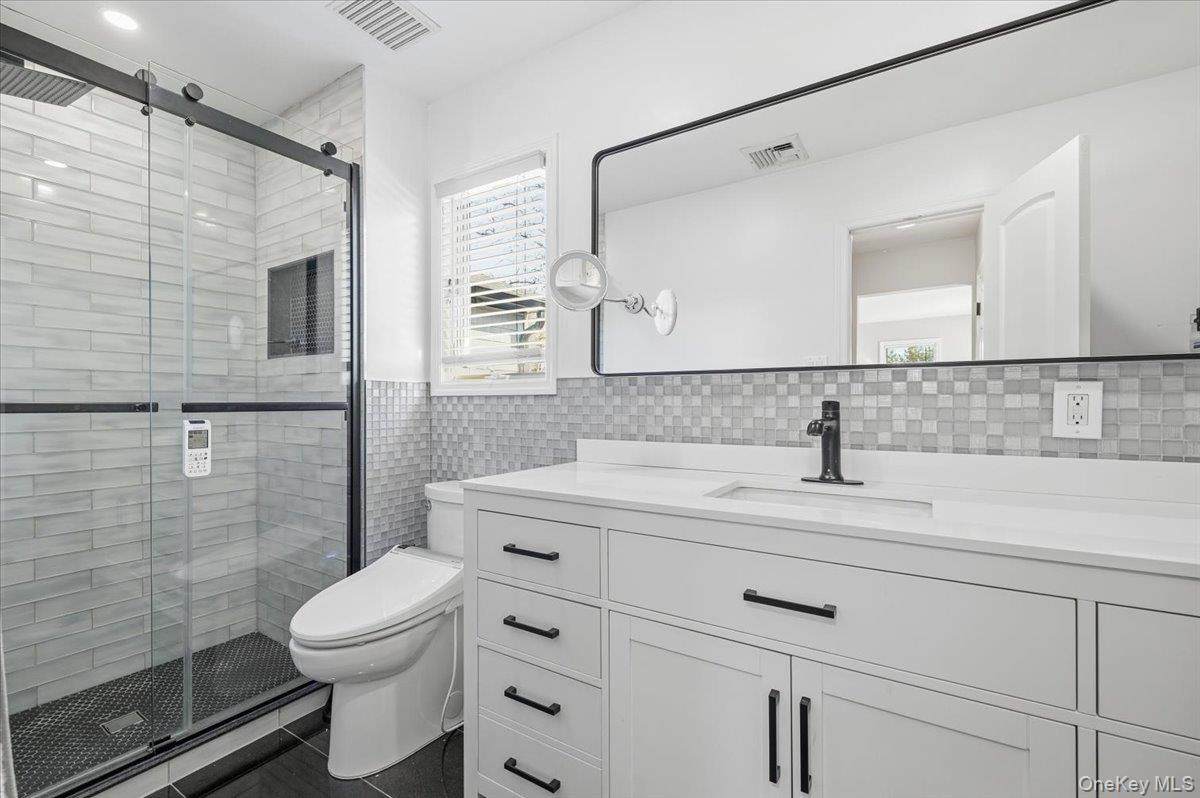 98 Barry Lane Syosset, NY 11791 - Photo 30 of 43 a bathroom with a granite countertop sink toilet and shower