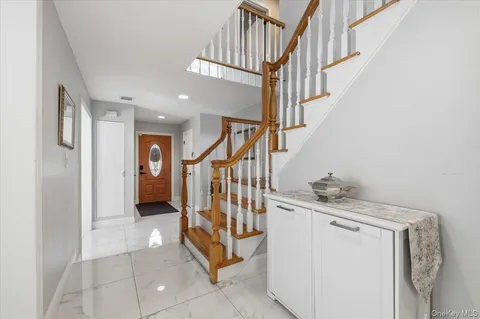 a view of entryway and hall with a window