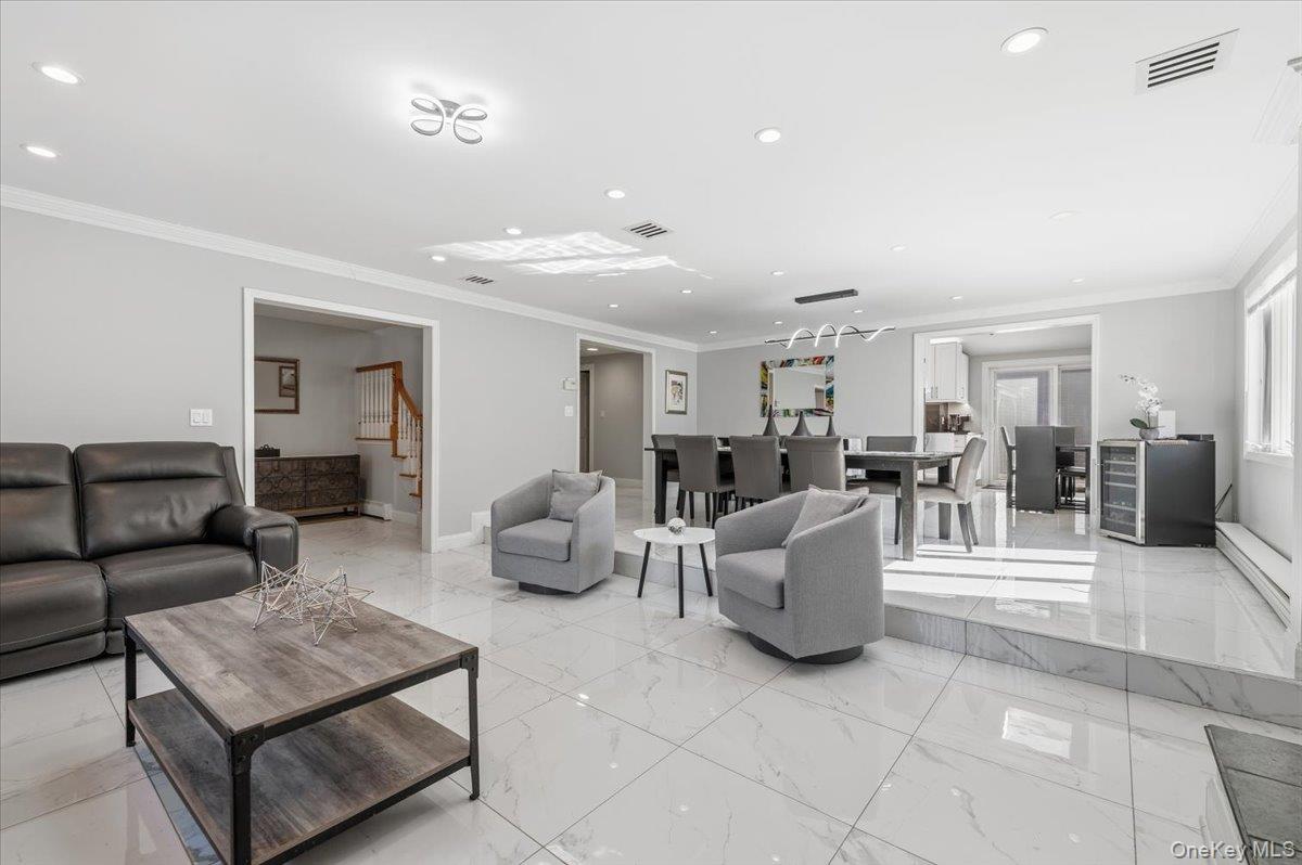 98 Barry Lane Syosset, NY 11791 - Photo 7 of 43 a living room with furniture and a table