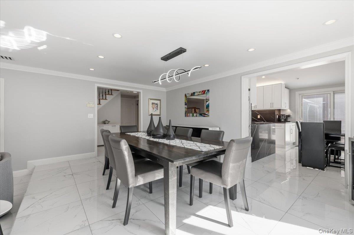 98 Barry Lane Syosset, NY 11791 - Photo 9 of 43 a view of a dining room with furniture