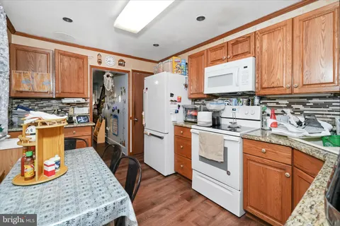 a kitchen with a stove and a refrigerator
