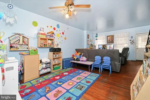 a children room with toys and a book shelf