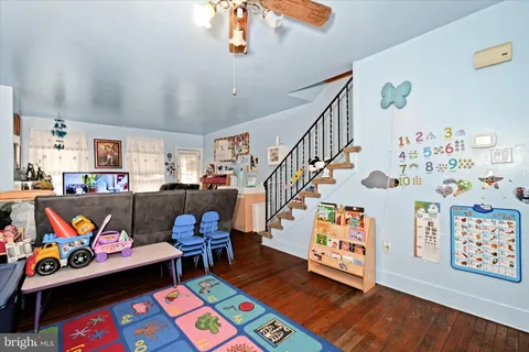 a room with furniture and a book shelf