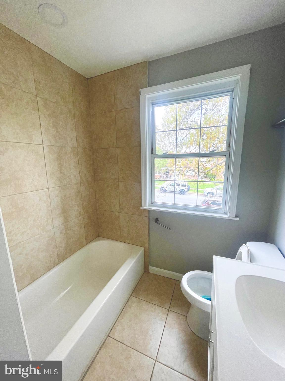 8528 Chestnut Oak Road, Unit B Baltimore, MD 21234 - Photo 15 of 15 a bathroom with a sink and bathtub