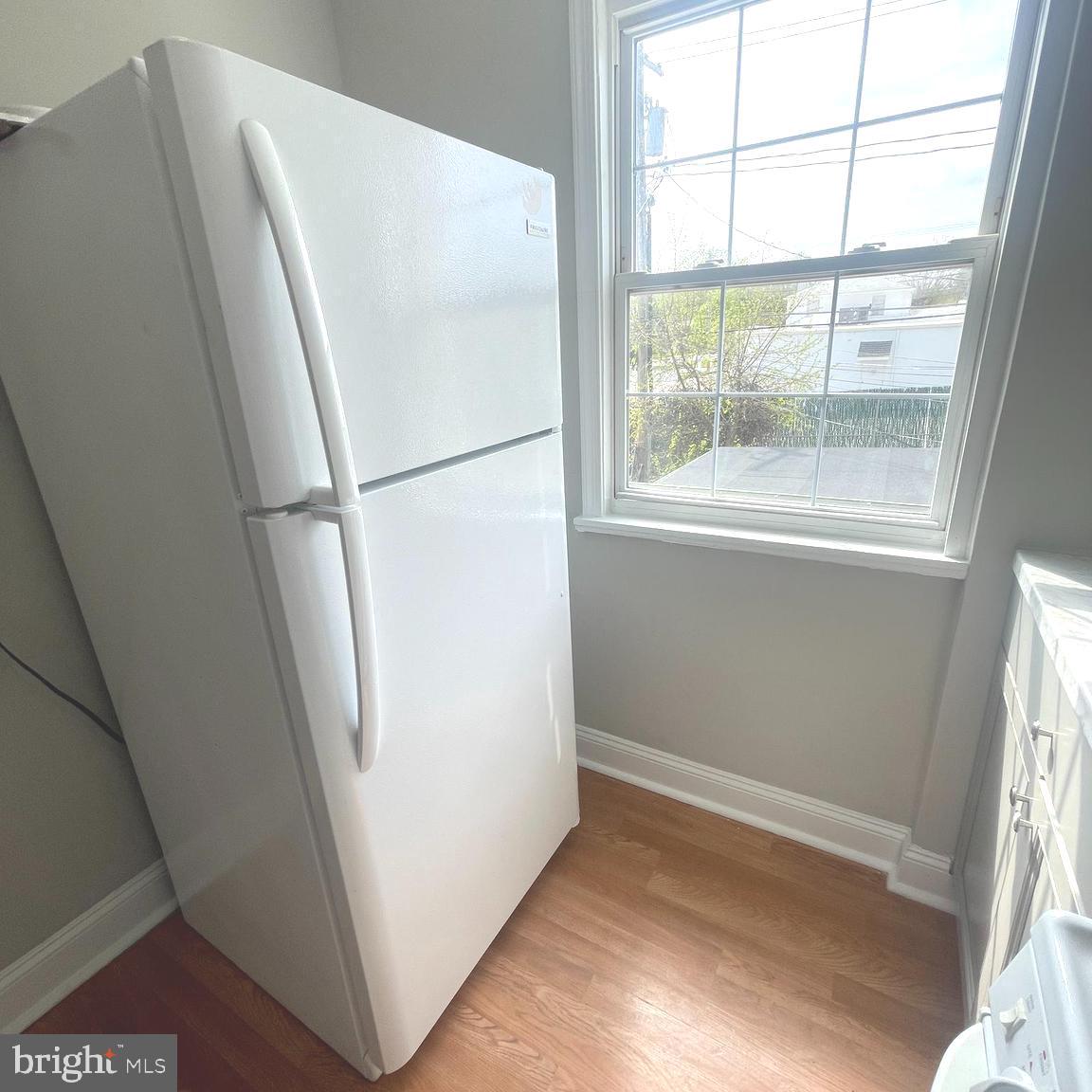 8528 Chestnut Oak Road, Unit B Baltimore, MD 21234 - Photo 7 of 15 a white refrigerator freezer sitting in a kitchen