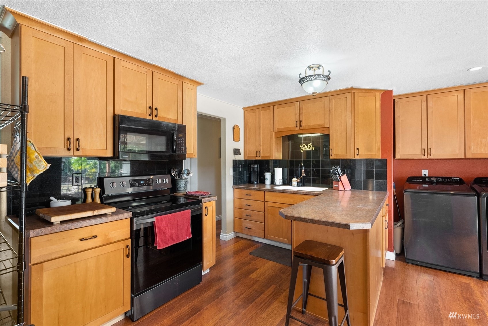 175 Ceres Hill Road Chehalis, WA 98532 - Photo 14 of 36 a kitchen with stainless steel appliances granite countertop a stove a sink and a microwave
