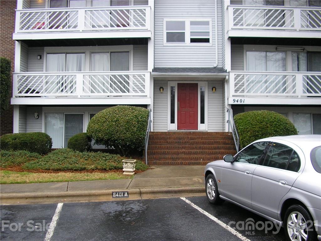 a view of a house with a patio and a fireplace