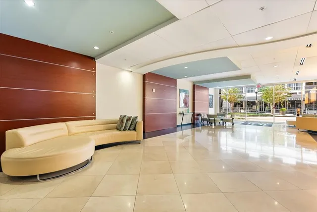 a lobby with furniture and a view of living room