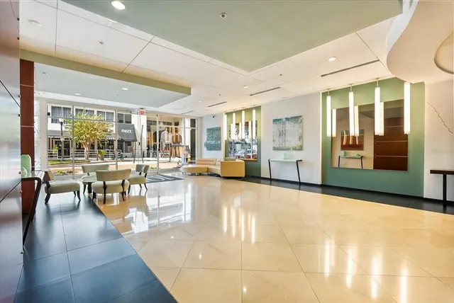 a view of a lobby with furniture and chandelier