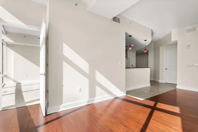 a view of a hallway view with wooden floor and staircase