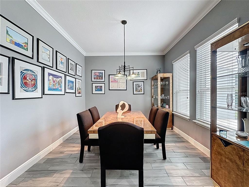 107 Balmy Coast Road Groveland, FL 34736 - Photo 18 of 97 a dining room with furniture and window