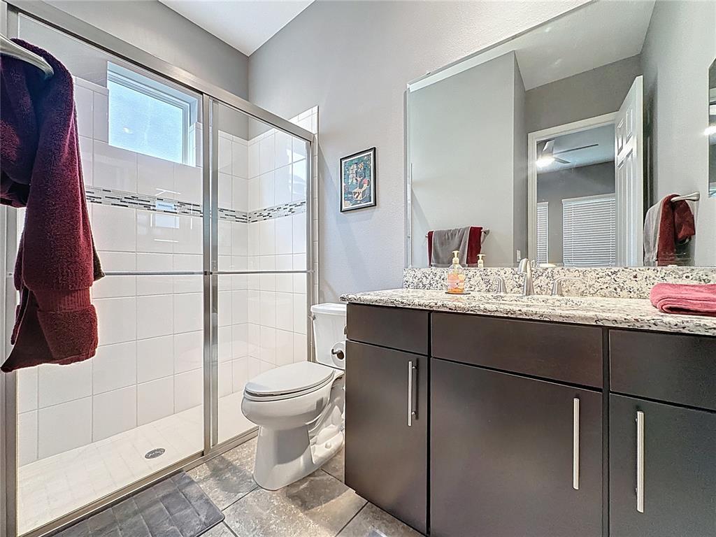 107 Balmy Coast Road Groveland, FL 34736 - Photo 34 of 97 a bathroom with a sink toilet and shower