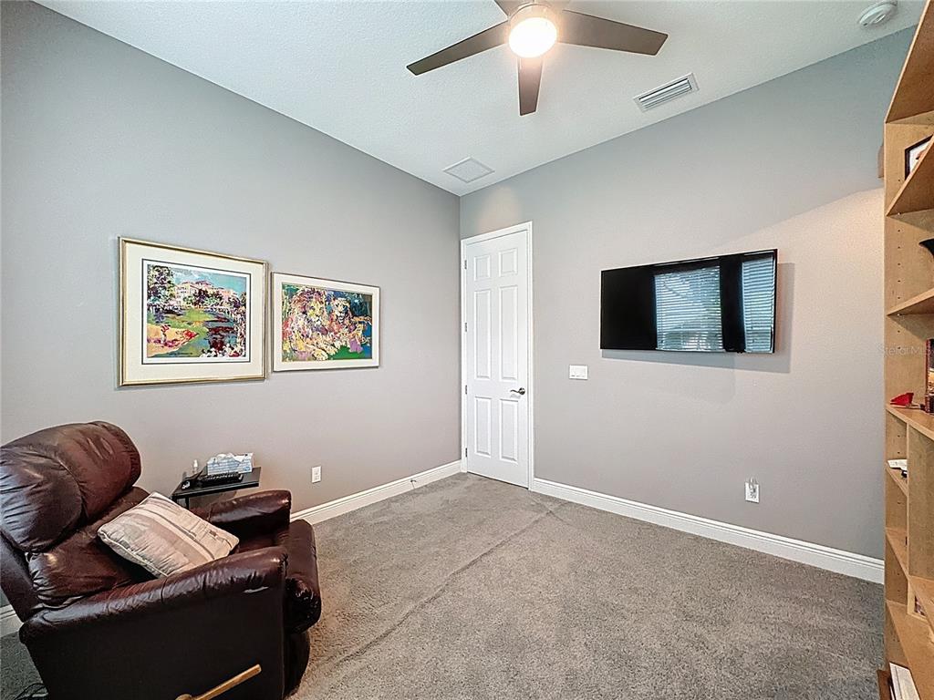 107 Balmy Coast Road Groveland, FL 34736 - Photo 49 of 97 a living room with furniture and a flat screen tv