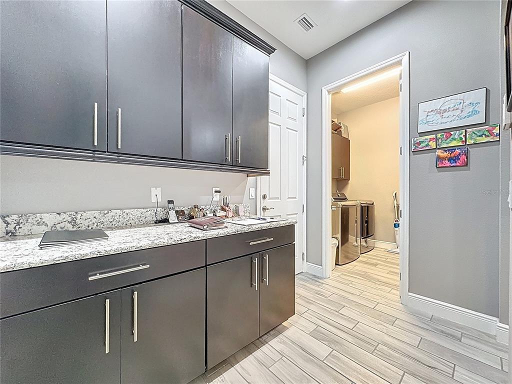 107 Balmy Coast Road Groveland, FL 34736 - Photo 53 of 97 a bathroom with a sink and a mirror