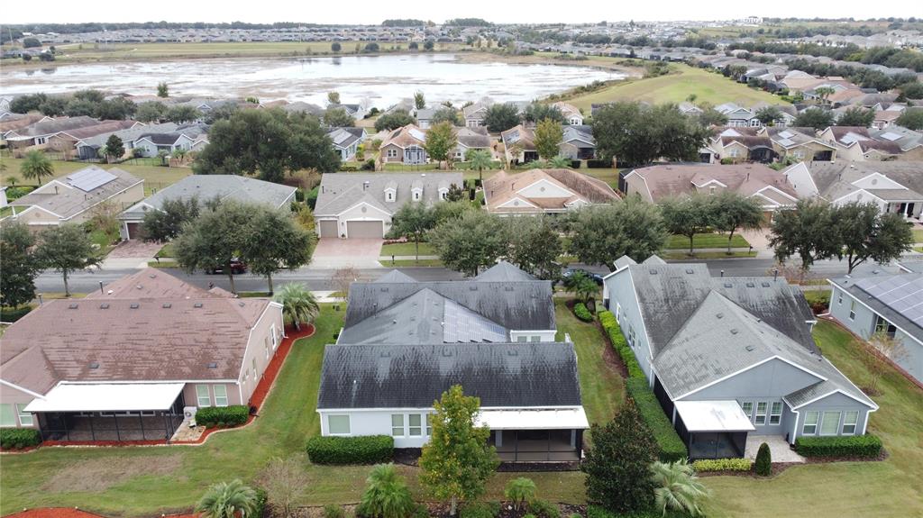 107 Balmy Coast Road Groveland, FL 34736 - Photo 74 of 97 an aerial view of residential houses with outdoor space and swimming pool