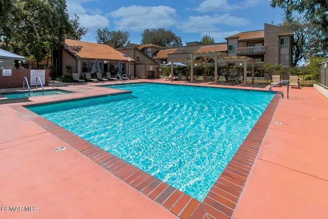 a front view of a house with a yard table and chairs